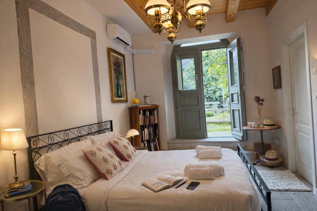 a bedroom with a bed with two towels on it at Aurisina residence in Aurisina