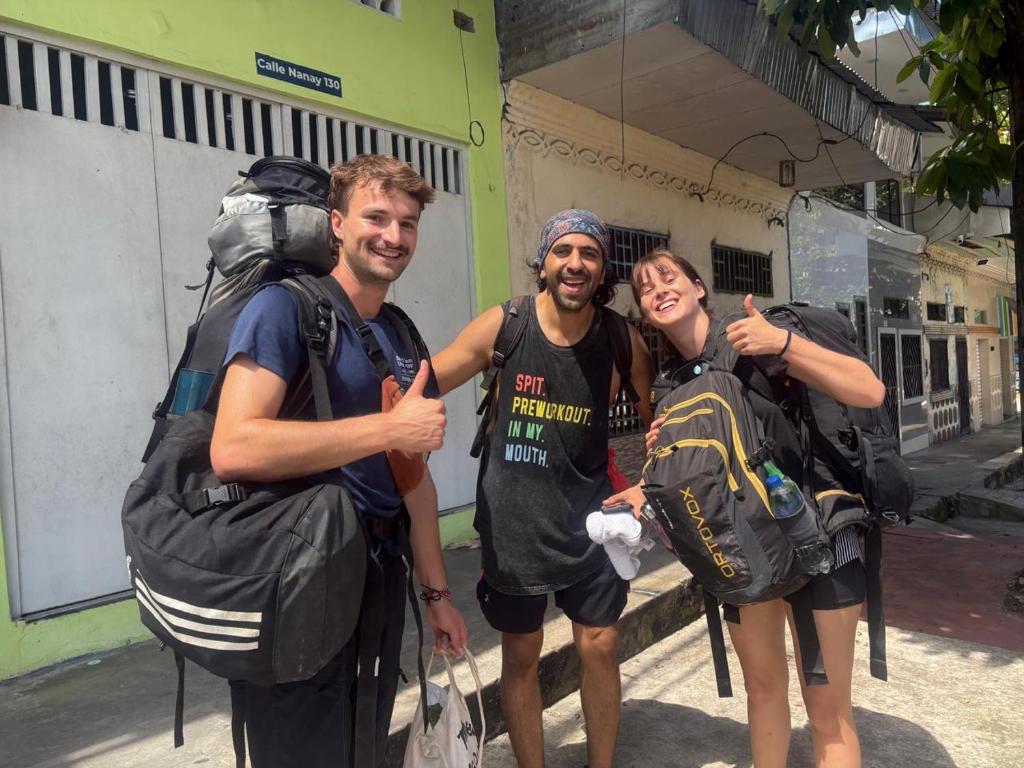 three people with backpacks posing for a picture at Amazon City House Iquitos in Iquitos
