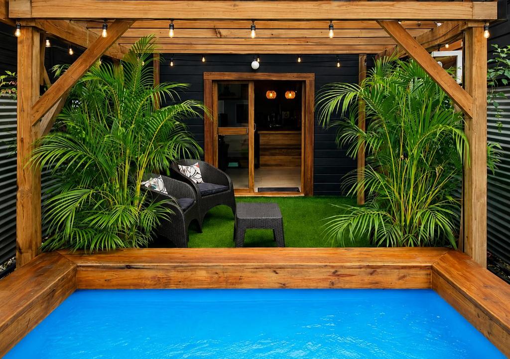 a house with a pool in the yard at Casita Don Marco in Bocas Town