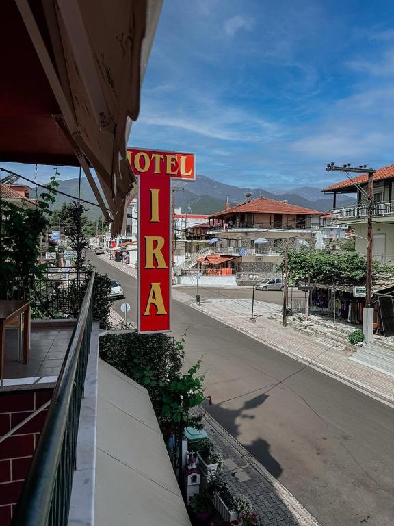a sign for a hotel on top of a building at Hotel Ira in Leptokarya