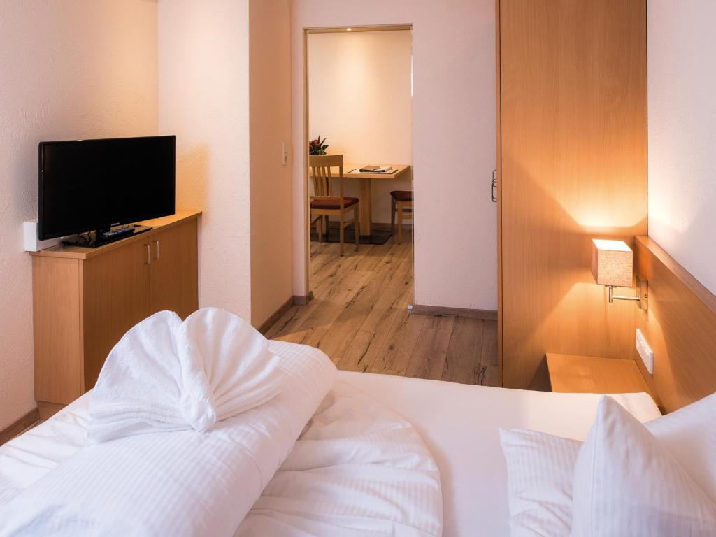 TV a/nebo společenská místnost v ubytování Hotel Garni Alpenjuwel