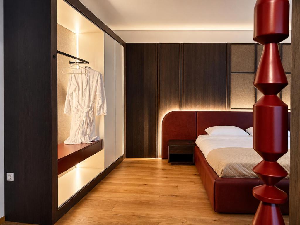 a bedroom with a bed and a red lamp at Design-Apartment Siegen Oberstadt in Siegen