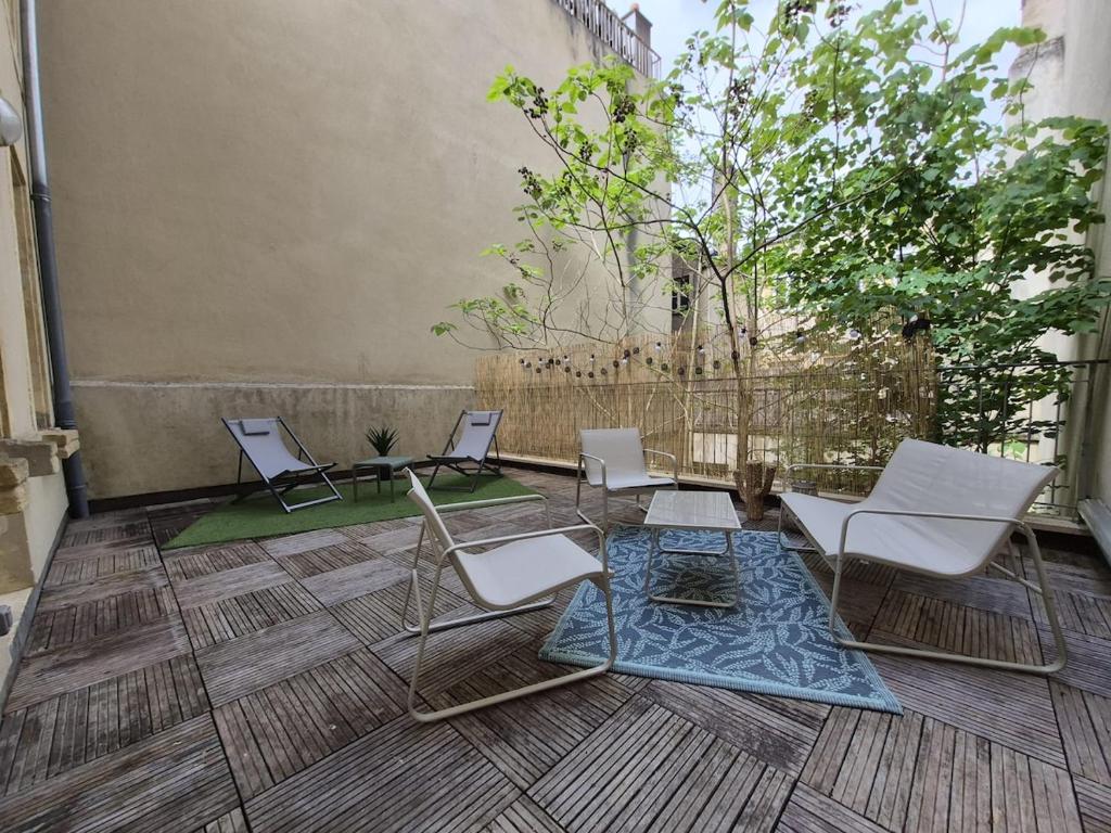 a group of chairs sitting on a patio at La terrasse du palais in Metz