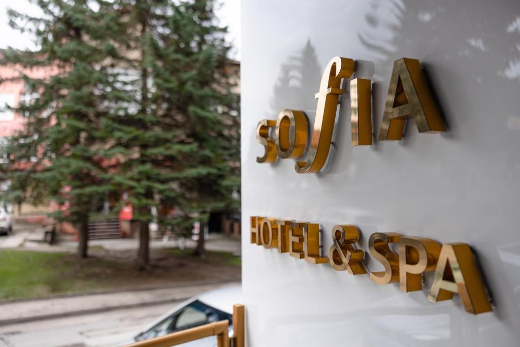 a sign on a wall that reads la hamburger at Sofia Hotel & Spa Truskavets in Truskavets