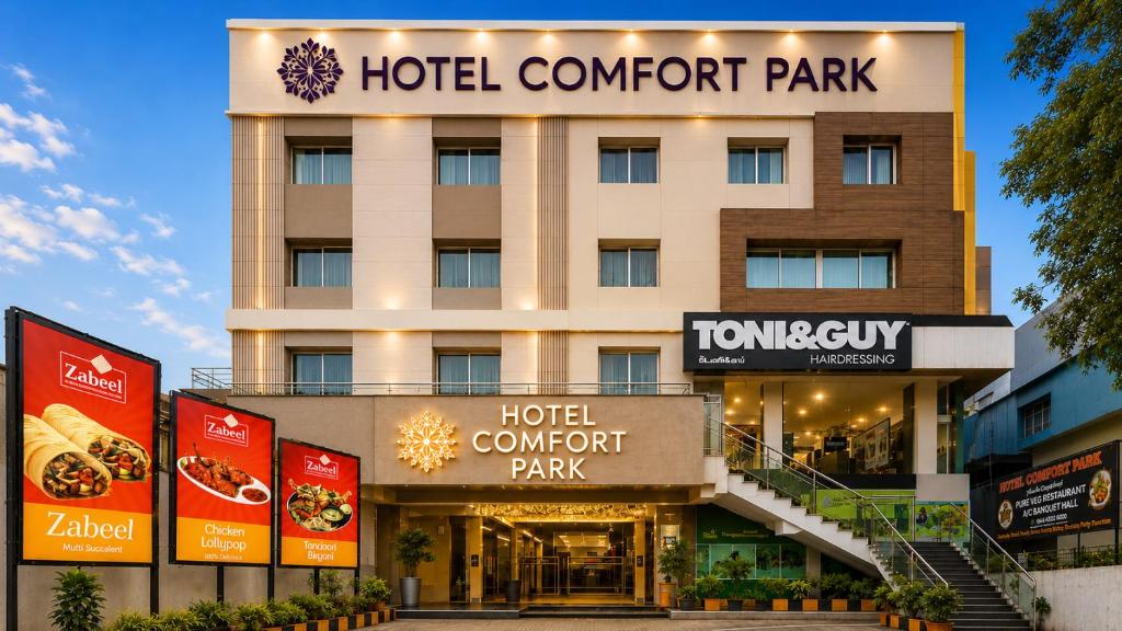 a hotel entrance with a hotel concurrent park at Hotel Comfort Park - Opposite Sri Ramachandra Medical College Porur in Chennai