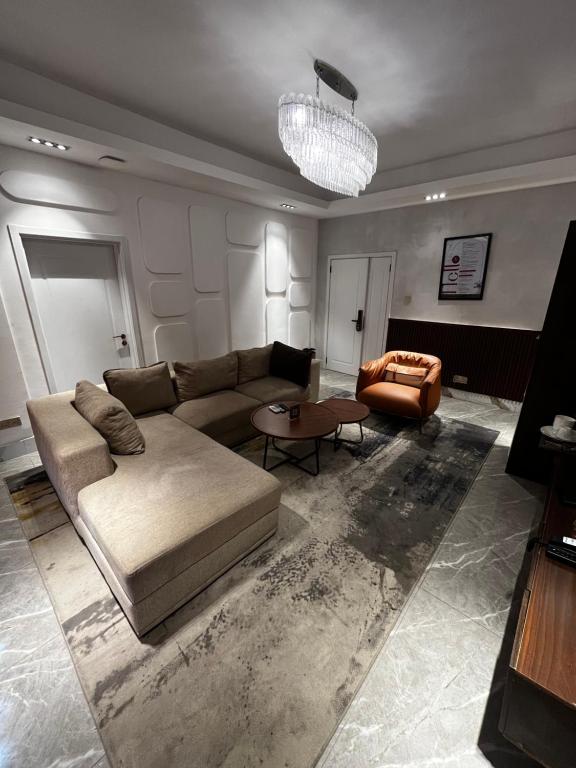 a living room with a couch and a table at Macdonald Residence in Lagos