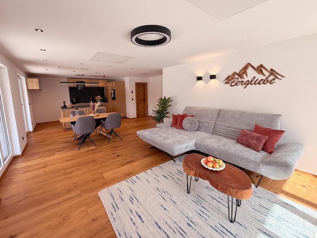a living room with a couch and a table at Apartment Bergliebe in Sellrain