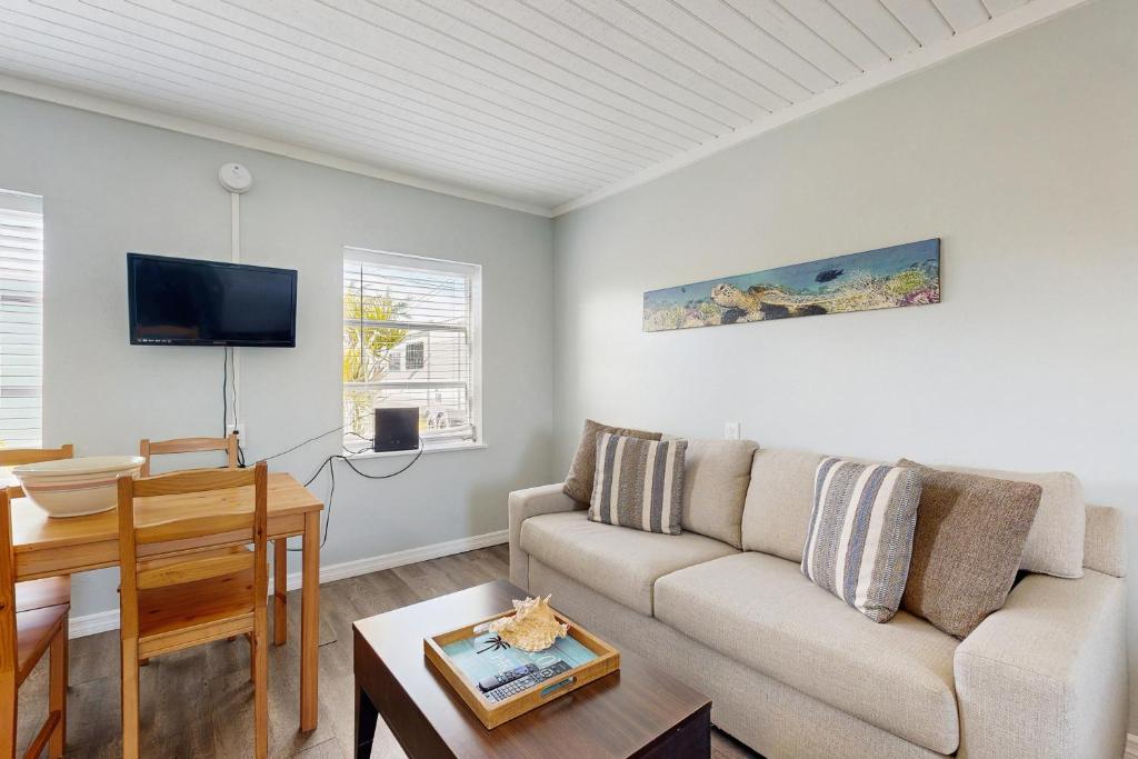 a living room with a couch and a table at CK03 Fisherman's Retreat in Conch Key
