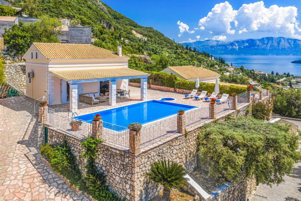 an image of a villa with a swimming pool at Villa Morfeas in Nydri
