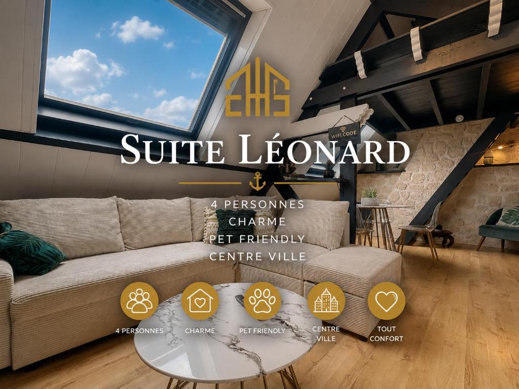 a living room with a couch and a glass table at Suite Léonard - Prestige et détente in Bray-Dunes