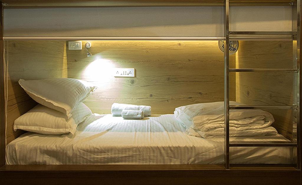 Postel nebo postele na pokoji v ubytování Pod N Beyond Smart Hotel