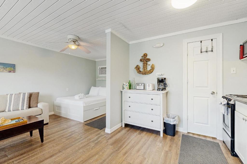 a living room with a couch and a table at CK03a Fisherman's Bungalow in Conch Key
