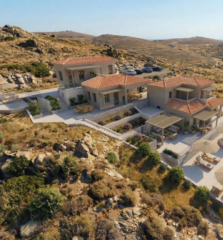 an aerial view of a house on a hill at Monte Vista Lemnos Apartments in Myrina