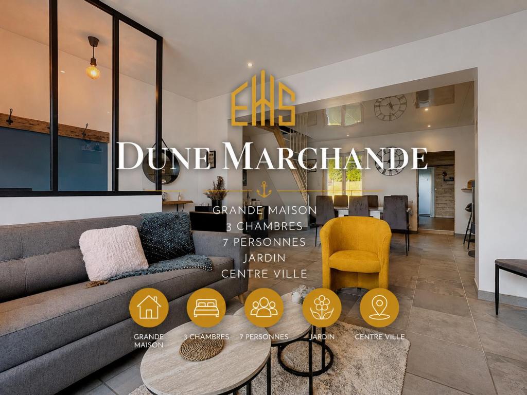 a living room with a couch and a table at Dune Marchande - Séjour Cozy in Bray-Dunes