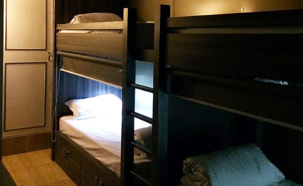 Postel nebo postele na pokoji v ubytování Pod N Beyond Smart Hotel