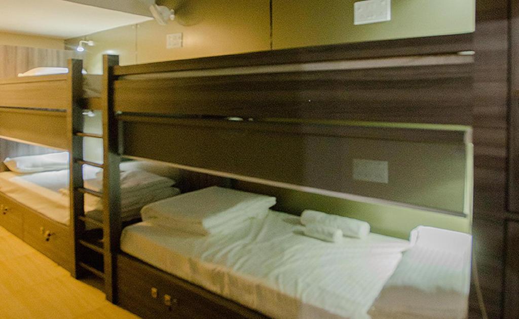 Postel nebo postele na pokoji v ubytování Pod N Beyond Smart Hotel
