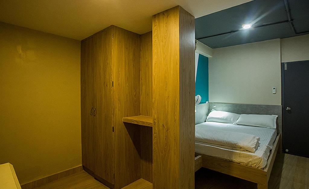 Postel nebo postele na pokoji v ubytování Pod N Beyond Smart Hotel
