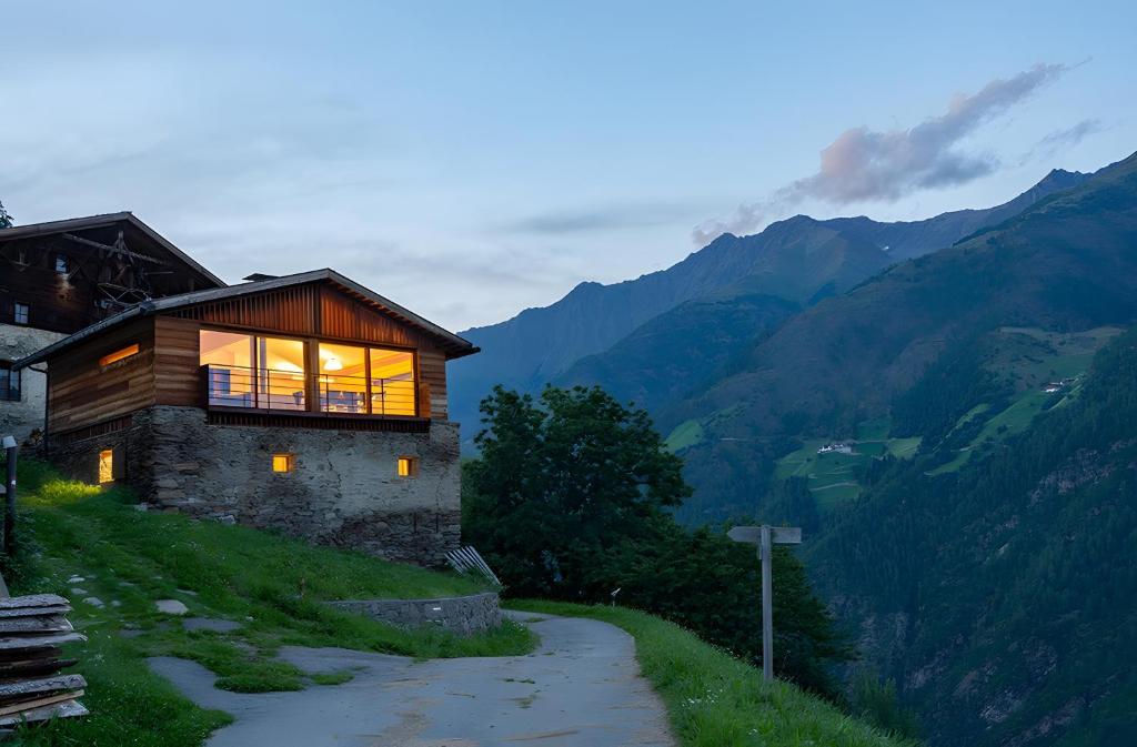 a house on the side of a mountain at Chalet Oberjuval in Kastelbell-Tschars