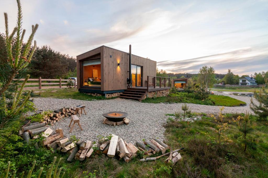 a tiny house sitting on top of a gravel yard at РІЗНОтрав'я in Solygy