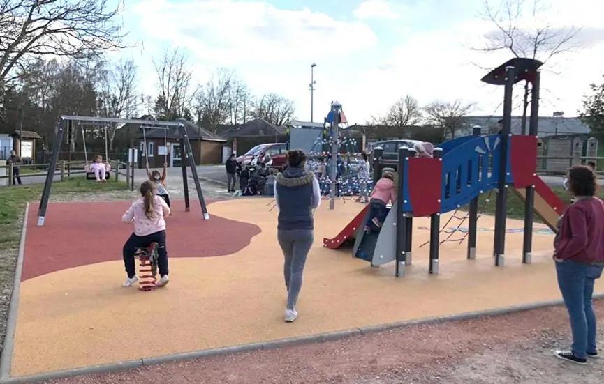 a group of people playing on a playground at Camping 3 étoiles - Piscine - ccbfghc in Mamers