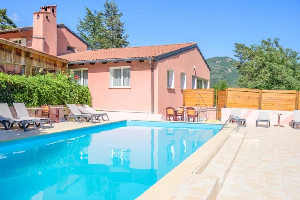 a swimming pool in front of a house at Camping 2 étoiles - Piscine - ccbgb0d in Sospel