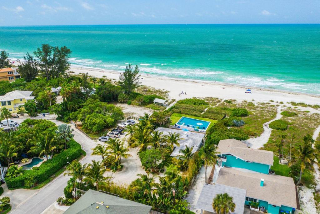 an aerial view of the beach and the ocean at Beachfront Bungalow in Holmes Beach