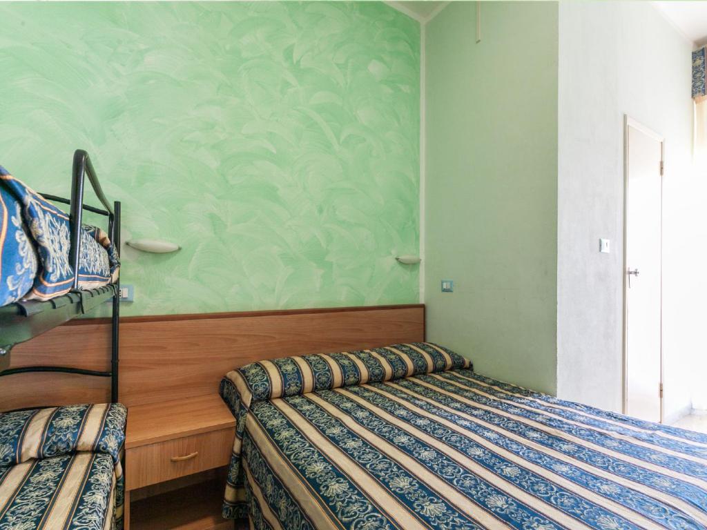 Postel nebo postele na pokoji v ubytování Hotel Promenade Universale