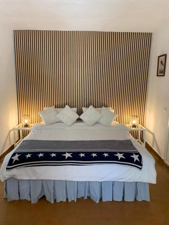 a bedroom with a bed with a blue and white blanket at Gorgeous Apartment in Jesús in Nuestra Señora de Jesus
