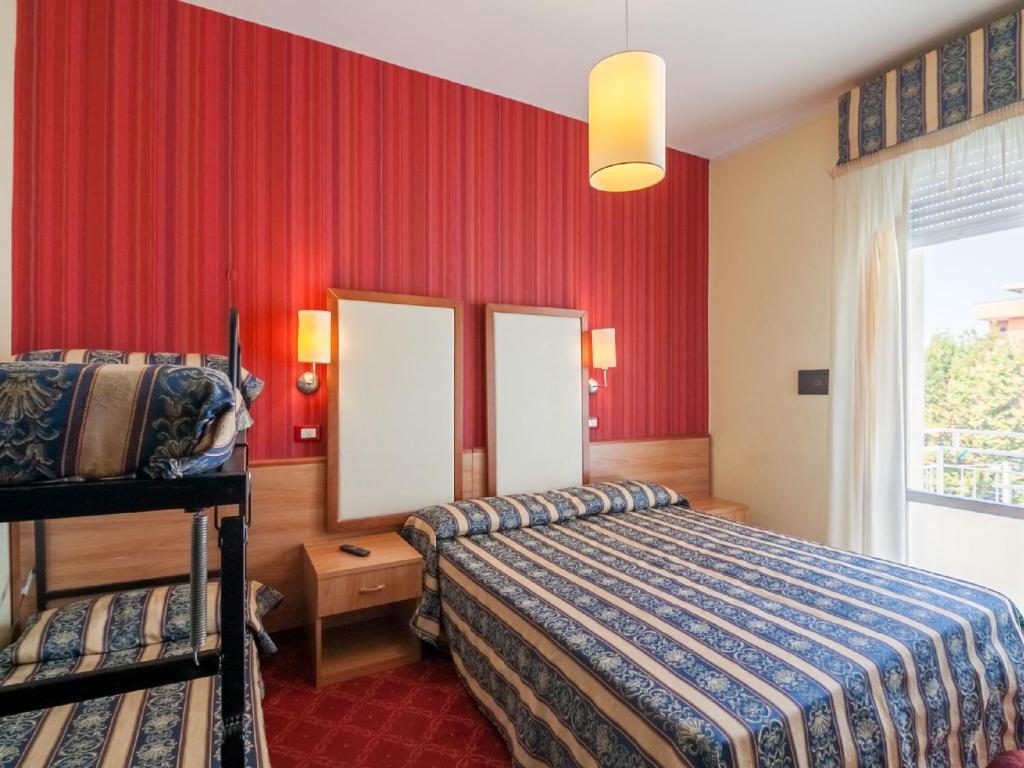 Postel nebo postele na pokoji v ubytování Hotel Promenade Universale