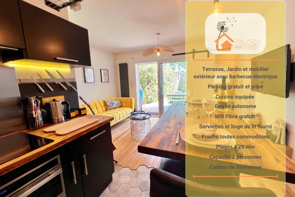 a kitchen with a table in a room at La Pause de Mérimée - Jardin - Parking in Vannes
