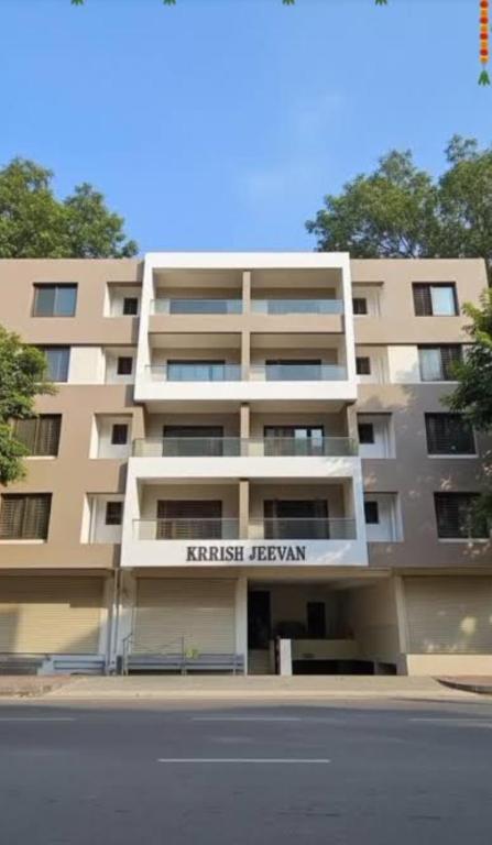 an apartment building with the words first renewal on it at Vayangankar House in Belgaum