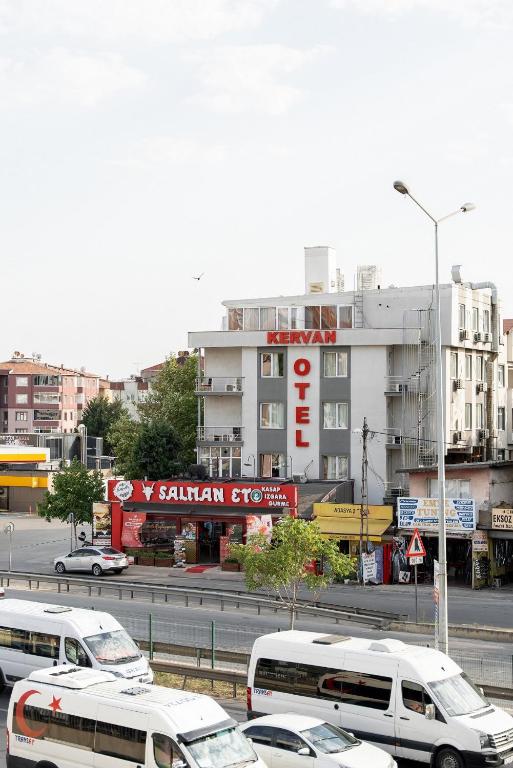 a group of buses and cars on a city street at Kervan Hotel Pendik in Istanbul