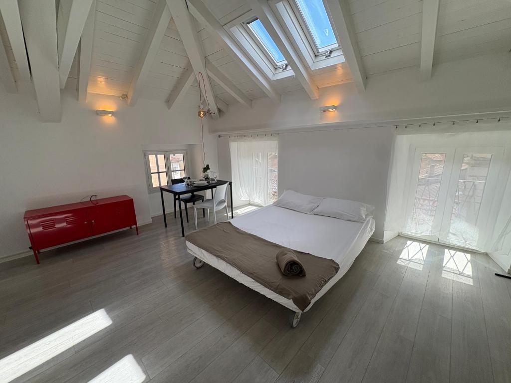 a bedroom with a bed and a table in it at Appartamento San Rocco in Intra