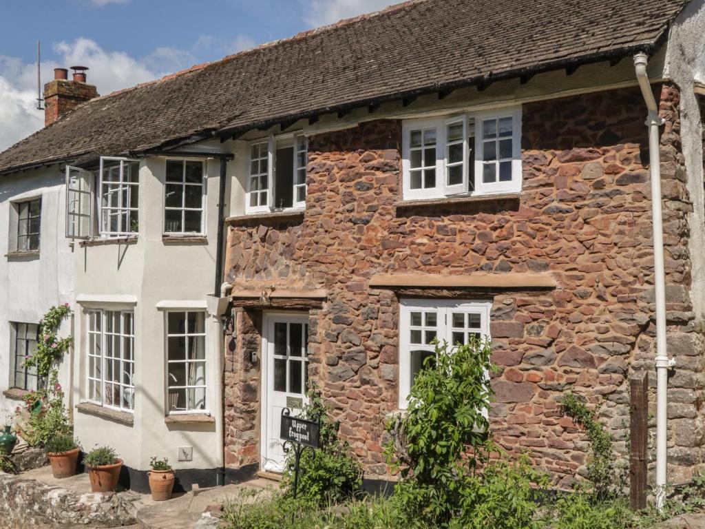 an old stone house in the village at Upper Frogpool Cottage in Crediton