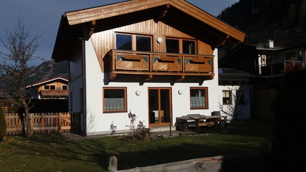 a house with a balcony on top of it at Ferienhaus Rauris in Rauris