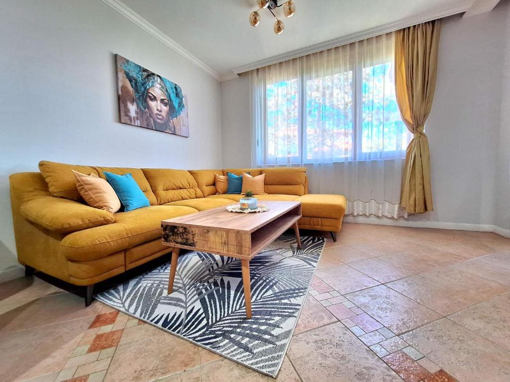 a living room with a couch and a coffee table at Marina Forest in Sozopol