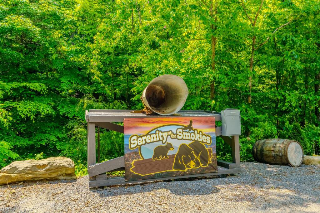 a sign for a grizzly station with a barrel on top at Serenity at the Smokies in Sevierville