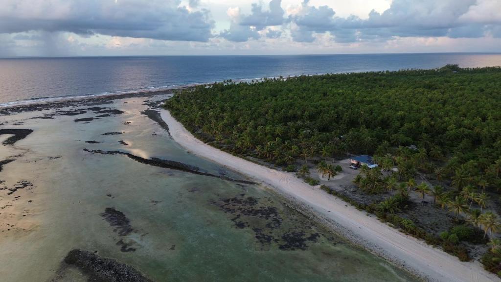 an aerial view of a beach and the ocean at Fare Te Vaite in Tikehau Airport