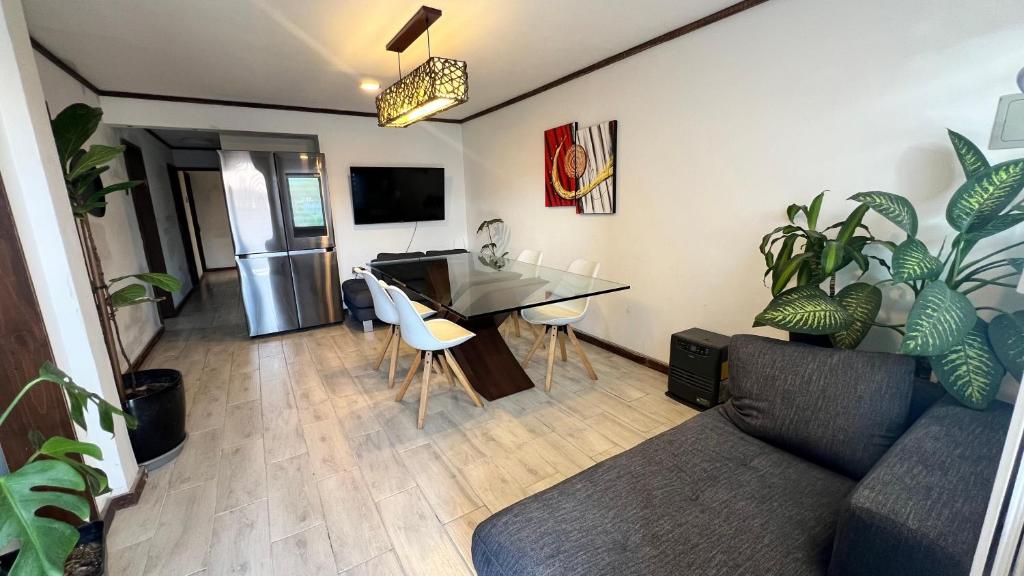 a living room with a couch and a table at House 78 in Coquimbo