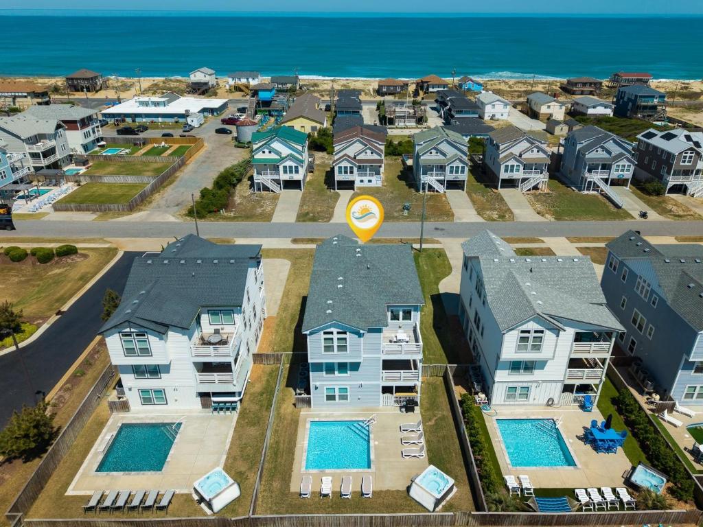 an aerial view of a residential neighborhood with houses at 4058 - Beach Haven in Kitty Hawk