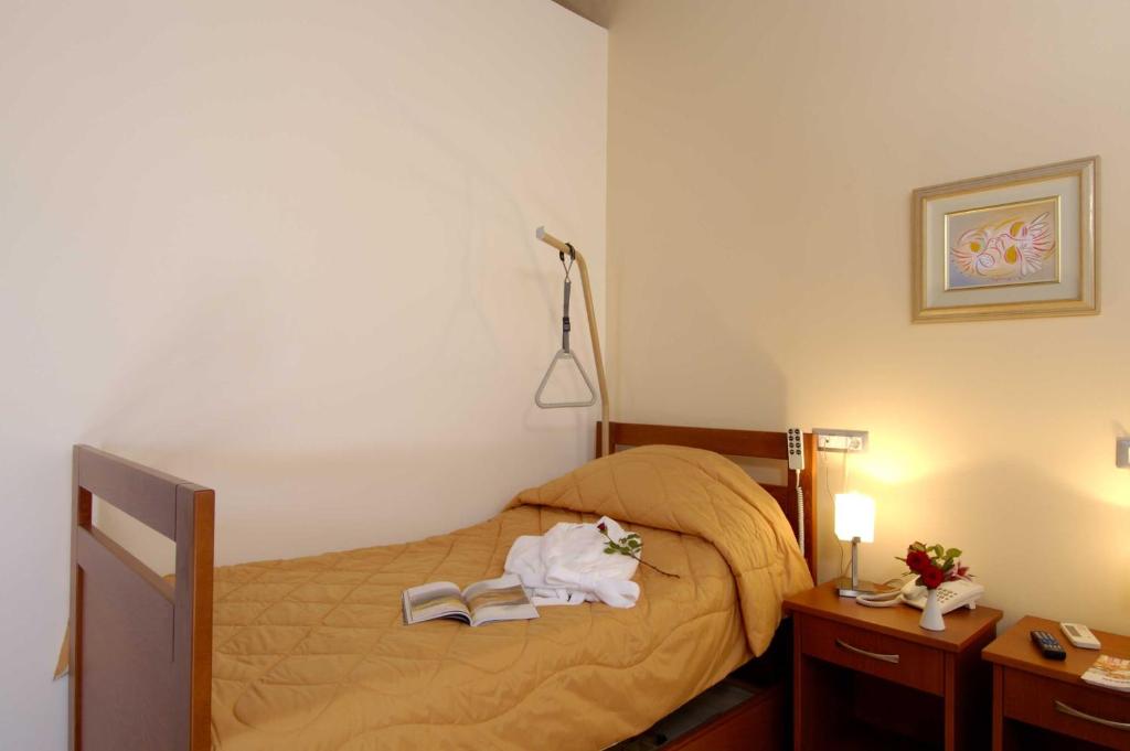 Posteľ alebo postele v izbe v ubytovaní ERIA RESORT for people with special abilities