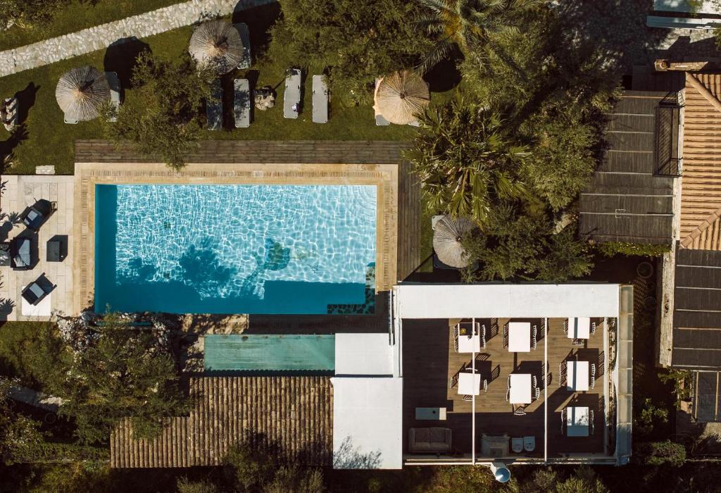 an overhead view of a swimming pool next to a house at Grantzaos Villas in Laganas