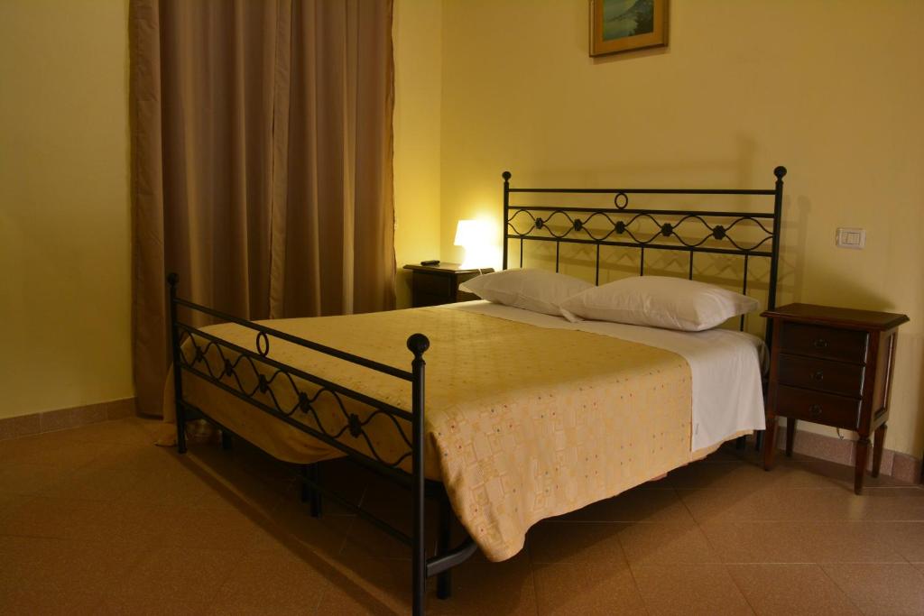 Łóżko lub łóżka w pokoju w obiekcie Villa Regina