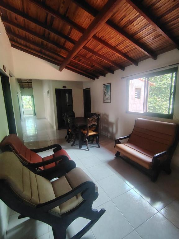 a living room with a couch and a table at Hostal El Renacer in Pinchote