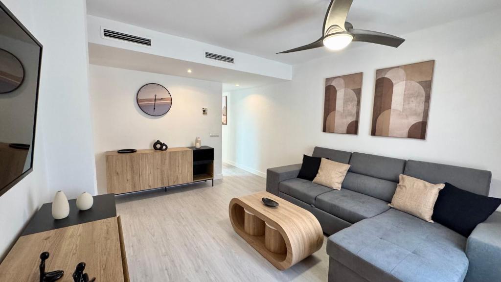 a living room with a couch and a table at San Miguel Centro in Torremolinos