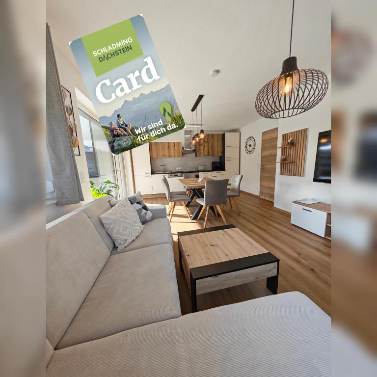 a living room with a couch and a table at Ferienwohnung Pruggernglück in Pruggern