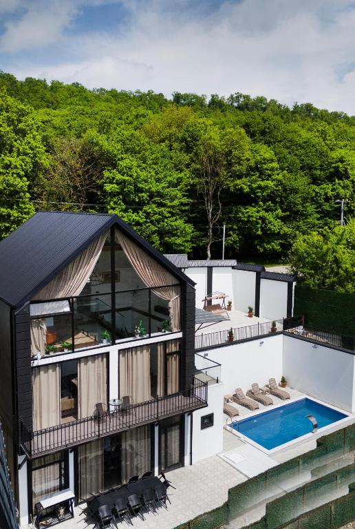 an aerial view of a house with a swimming pool at Quba QubaLand in Qǝlǝduz