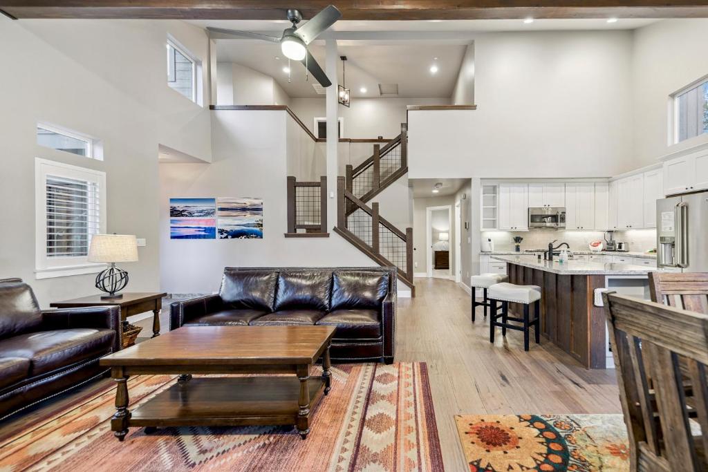 a living room with a couch and a table at Chalet Near The Tahoe Keys in South Lake Tahoe