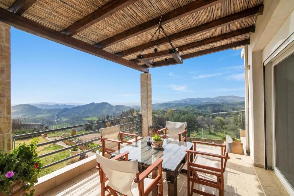 a dining room with a table and chairs on a balcony at The House Olympia - Happy Rentals in Olympia