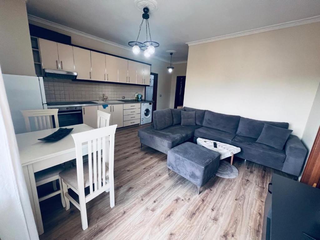 a living room with a couch and a table at B&B Tirane in Tirana
